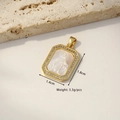 Gold plated octagonal pendant with white mother of pearl and crystal rim, 1.4x1.8cm - Sun Goddess (Carved Shell)