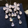 Macro shot of silver bow pearl earrings with crystal tassels on navy velvet background - 28# Silver Five-Petal Flower Tassel Studs