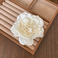 Elegant white fabric orchid hair clip with pearl accents on a brown leather jewelry box - Pure White Simulation Flower (4)