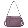 Purple textured faux leather crossbody bag with multiple zip pockets and adjustable strap - Purple