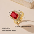 Detail shot of golden ring with red square gem and diamonds showing 1.95cm size specs - Red Gemstone Ring