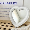 Charming white heart-shaped vanity mirror with beaded edge on a wooden surface - White