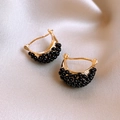 Close-up of golden semi-circle earrings with black beads on premium champagne silk - 46# Ear Buckle - Gold - Black