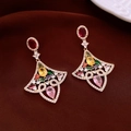 Macro detail of fan-shaped gold earrings with vibrant multi-color gemstones on brown velvet - Gold-Pink-Multicolor (Fan Gem Style)