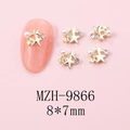 Detailed close-up of golden hollow double star nail charms with pearls and rhinestones - MZH-9866 (8*7mm)