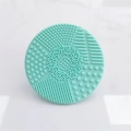 Light green silicone makeup brush cleaning mat with suction cup and multi-texture surface - Round Shape / Green