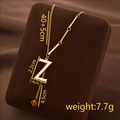 Gold titanium steel necklace featuring letter Z pendant with fringe and small cube detail - Letter Z / Gold
