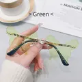 Frameless butterfly sunglasses with green tinted lenses and gold metal bridge - Green