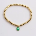 Bracelet minimaliste à billes dorées avec pendentif œil maléfique en émail vert - Vert