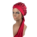 Macro detail of red satin sleep bonnet featuring long ribbons and wide brim on model - One Size / Burgundy