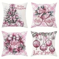 Detail view of 4 pink and white Christmas pillow covers with holiday patterns and greetings - Pink White Soft Winter Set