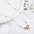 Elegant 18K gold-plated bow necklace with delicate beaded chain on a minimalist display - Bowknot Necklace (x976) / Gold
