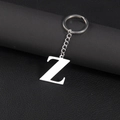 Silver stainless steel letter Z keychain pendant on a premium dark leather background - Letter Z