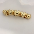 Elegant gold hammered heart hair clip with five linked hearts for a minimalist style - Gold Hammered Heart Clip