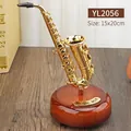 Vintage golden saxophone music box on mahogany wood base with elegant desk ornaments - Saxophone Music Box