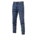 Detailed macro view of deep blue washed denim fabric with retro whiskers on slim fit jeans - Medium Blue & White