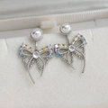 Macro shot of silver bow knot earrings with colorful zircon stones and round pearls - 26# 25071B Silver Pearl Bowknot