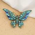 Vintage style butterfly brooch in gold with blue rhinestones and AB crystal accents - Style 62/Ancient Gold Lake Blue