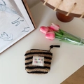 Mini fuzzy striped makeup bag in brown and black faux fur with branded woven patch - Brown Stripes