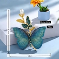 Elegant gold-tone butterfly brooch with blue mesh wings, green crystals, and a pearl drop - Blue Mesh Butterfly
