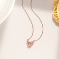 Close-up of rose gold Mickey pendant featuring a shimmering central zircon stone - Floating Mickey Style (8933) / Rose Gold