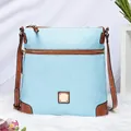 Close-up of light blue lychee pattern leather handbag with brown straps and gold buckle - Light Blue