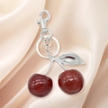 Porte-clés cerises rouges scintillantes avec feuilles argentées sur tissu de soie beige - Cerise Argent