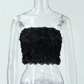 Detail of 3D rose textures on a black tube top with satin finish and strapless design - S / Black