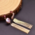 Baroque pearl tassel earrings with pink stones and gold texture on wood base - Purple Baroque Pearl Tassel Earrings