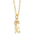 Close-up of golden letter K pendant with crown detail and sparkling small rhinestones - Letter K