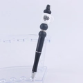 Detail of DIY beaded pen featuring a white coffee cup topper with Mama needs Coffee text - 7#Mama Needs Coffee