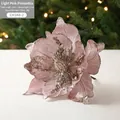 Light pink artificial Christmas flower with sparkling sequins and festive bokeh background - Pink