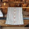 Bohemian woven camping blanket with geometric patterns and fringe hanging on loft railing - 160X130CM / Yellow Brown Geometric