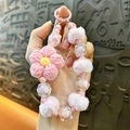 Adorable handmade pink crochet flower and soft pom-pom beaded phone charm strap accessory - Pink