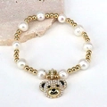 Bracelet en perles chic avec perles dorées et pendentif ours pavé de perles - Style mix perles et billes d'or