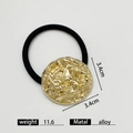 Elastic hair tie featuring a 3.4cm round golden alloy charm with a textured finish - Round Lava Rock Gold