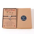 Detail of school dinosaur bracelet set with heart cutout charms on display card - Boxed Set (B00447) / Set of 2