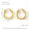 Detail of 18K gold plated stainless steel U-shaped hoop earrings 26mm by 23mm size - 18K Gold / Gold