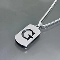 Detailed view of silver titanium steel G-letter pendant necklace on box chain - Letter G