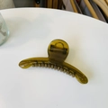 Close-up of translucent olive green resin hair claw clip with durable metal spring mechanism - Jelly Yellow Green
