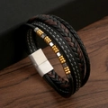 Close-up of multilayer braided leather bracelet with metal beads and magnetic clasp - Black + Gold