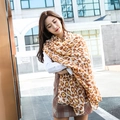 Elegant lightweight scarf with leopard print pattern worn by a model in a street style view - Flower Leopard Yellow