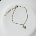 Delicate 18K gold plated bracelet featuring a sparkling zircon initial M pendant charm - Letter M