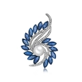 Elegant rotating flower brooch with a large white pearl and blue rhinestones on silver - Silver Base Blue Stone