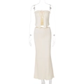 Close-up detail of cream white tube top with tie-front and high waist slim fit maxi skirt - S / Apricot