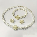 Elegant white pearl jewelry set with golden rose charms including necklace and earrings - Rose Flower Design Artificial Pearl Style