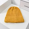 Yellow chunky knit beanie for women with a cuffed design for winter warmth - One Size / Yellow