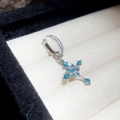 Macro shot of silver cross hoop earring with blue gemstones and micro-pave white zircons - Blue Cross Pendant (Single) / Silver