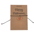 Close-up of Halloween wish bracelet with pumpkin charm on Happy Halloween card - Pumpkin Style