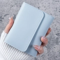 Minimalist light blue bi-fold short wallet with litchi texture and white stitching - Light Blue